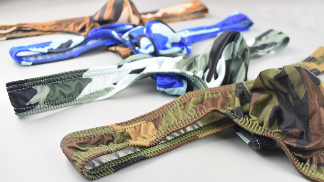 Colorful camouflage men's thong underwear in various patterns and designs.