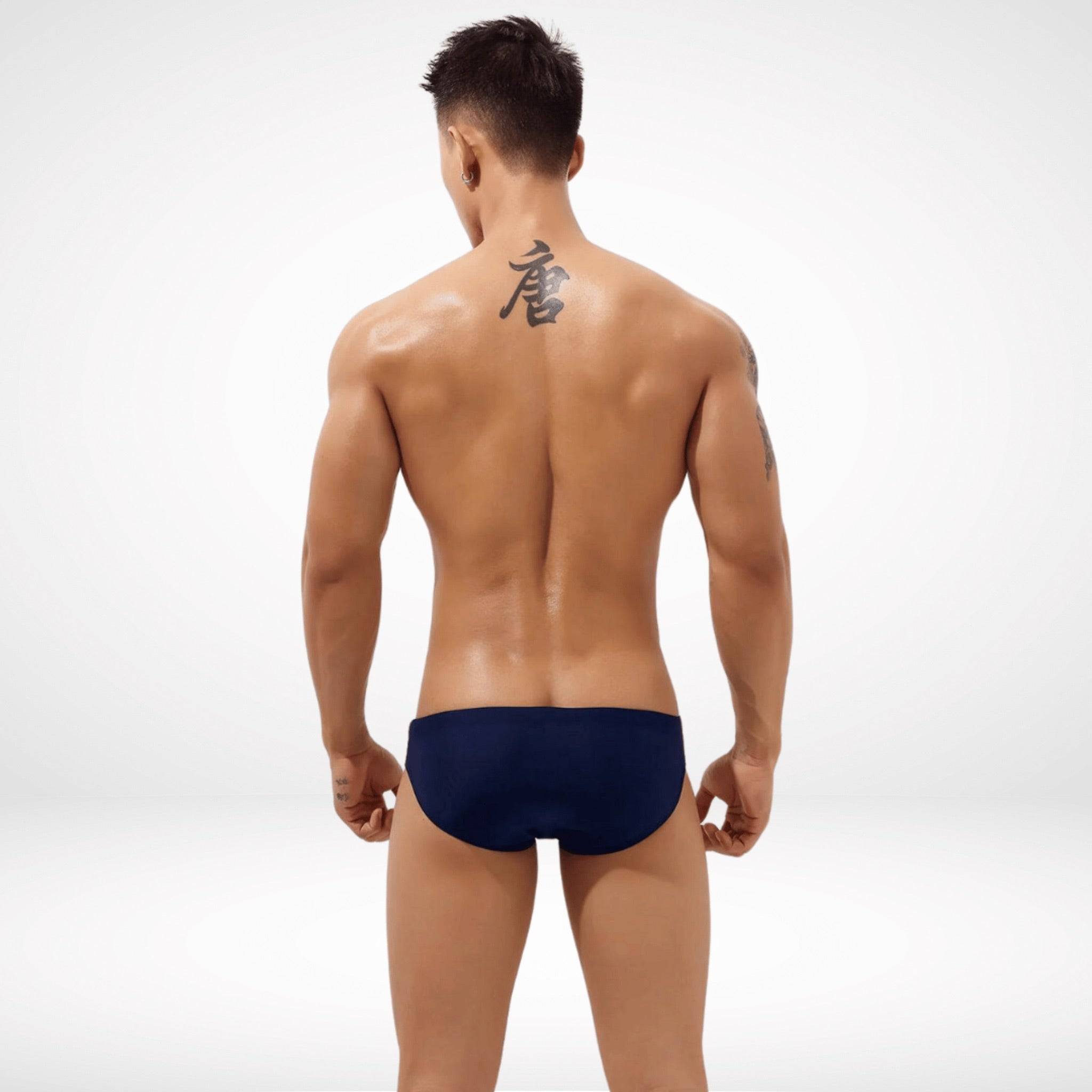 Back view of navy Aura Cutout Swim Briefs showcasing a sleek and secure fit for a polished swimwear appearance.