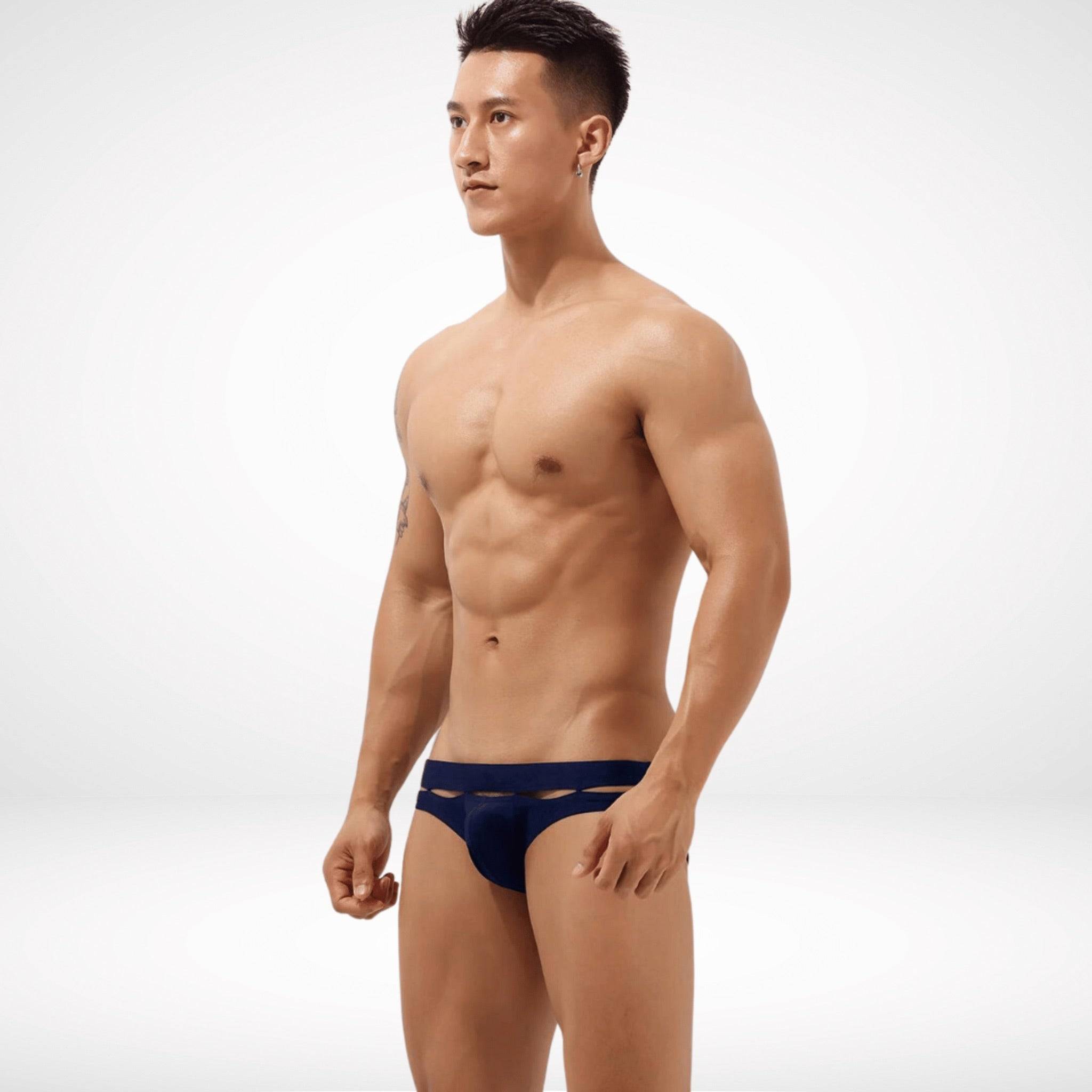 Side view of navy Aura Cutout Swim Briefs emphasizing the cutout details and modern fit for a refined swimwear style.