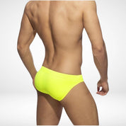 Back view of men's yellow swim briefs featuring a snug fit and durable fabric, perfect for beach and pool activities.