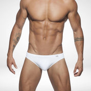 Men's white quick-dry swim briefs with a clean, stylish design, offering a secure fit and removable pad for versatile swimwear.