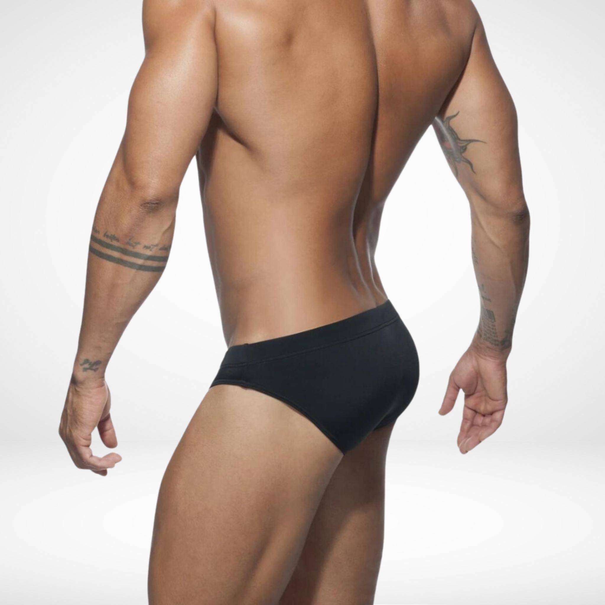 Back view of men's black swim briefs featuring a comfortable fit and durable fabric for stylish beach and pool wear.