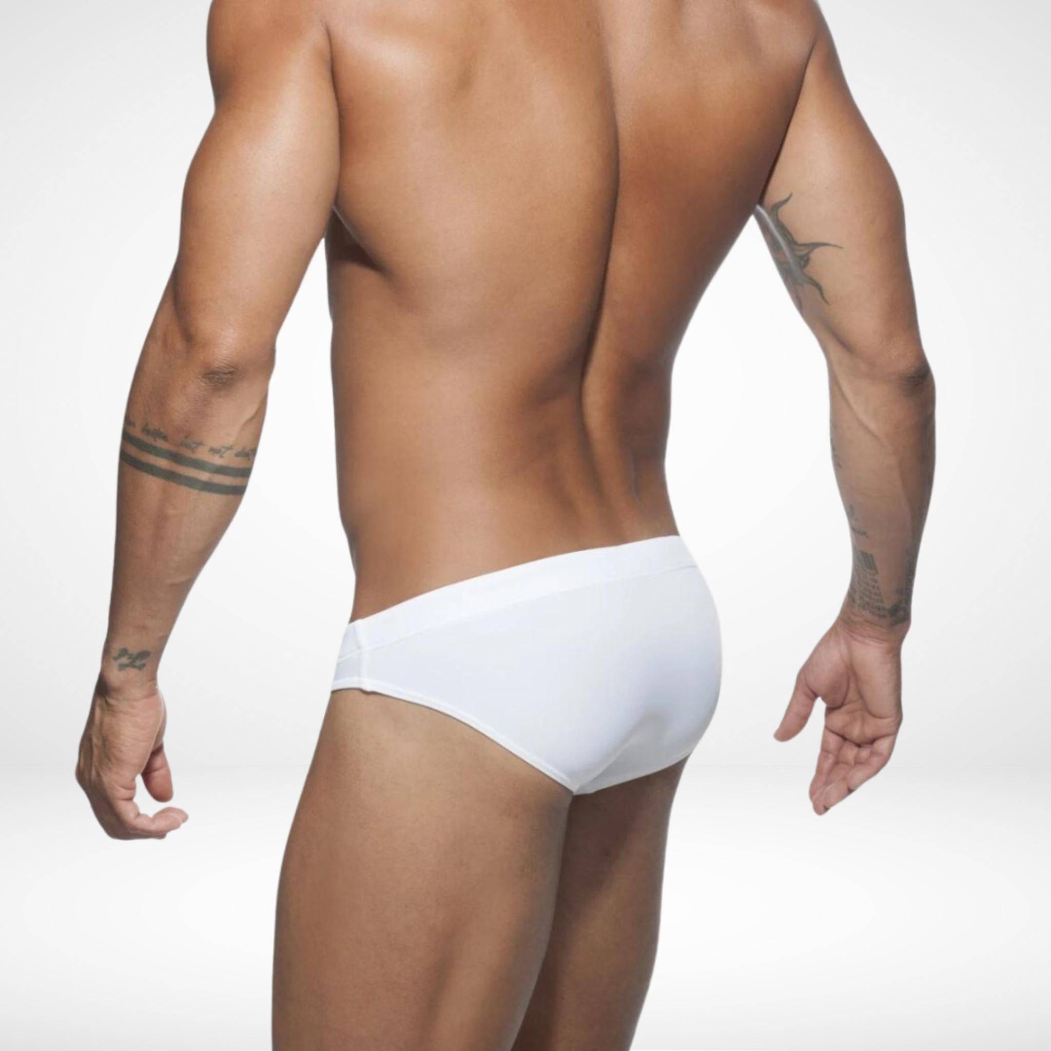 Back view of men's white swim briefs highlighting a snug fit and durable fabric, perfect for beach and pool activities.