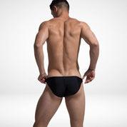 Men's black bikini swim briefs with high side cut, showcasing a sleek back view and low-rise design for a modern swimwear look.