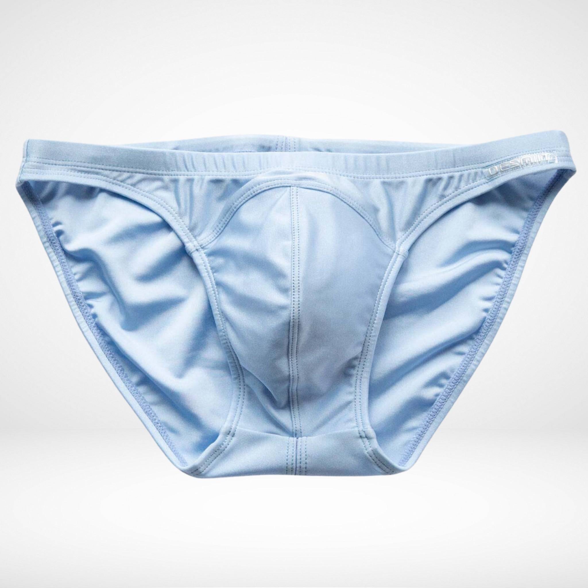 Close-up of men's light blue bikini swim briefs, emphasizing the detailed stitching and high-quality fabric for durability and comfort.