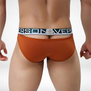 Back view of rust orange Brave Person hollow back men's briefs with green waistband, blending boldness with comfort.