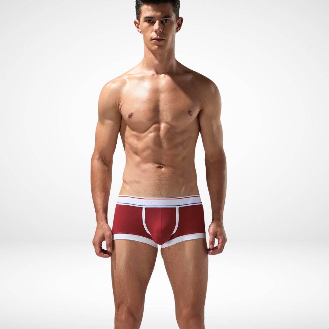 Red breathable cotton stretch boxer briefs for men with white trim and a flexible waistband, offering comfort and durability.