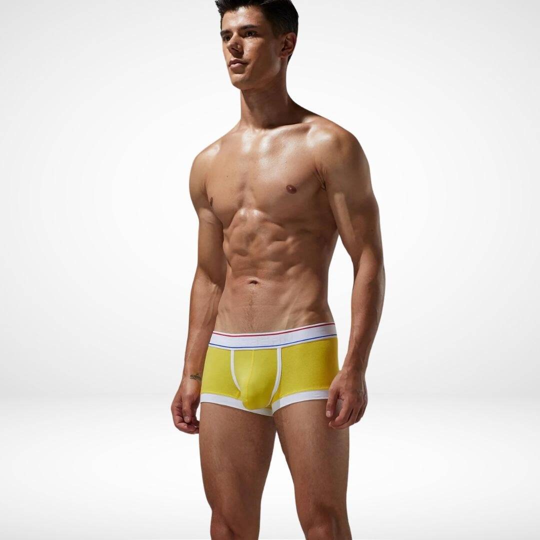 Yellow breathable cotton stretch boxer briefs for men with white trim and a flexible waistband, offering comfort and durability.