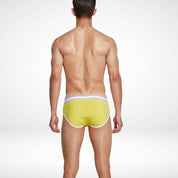 Back view of yellow breathable cotton stretch briefs for men with white piping and a snug, supportive design.