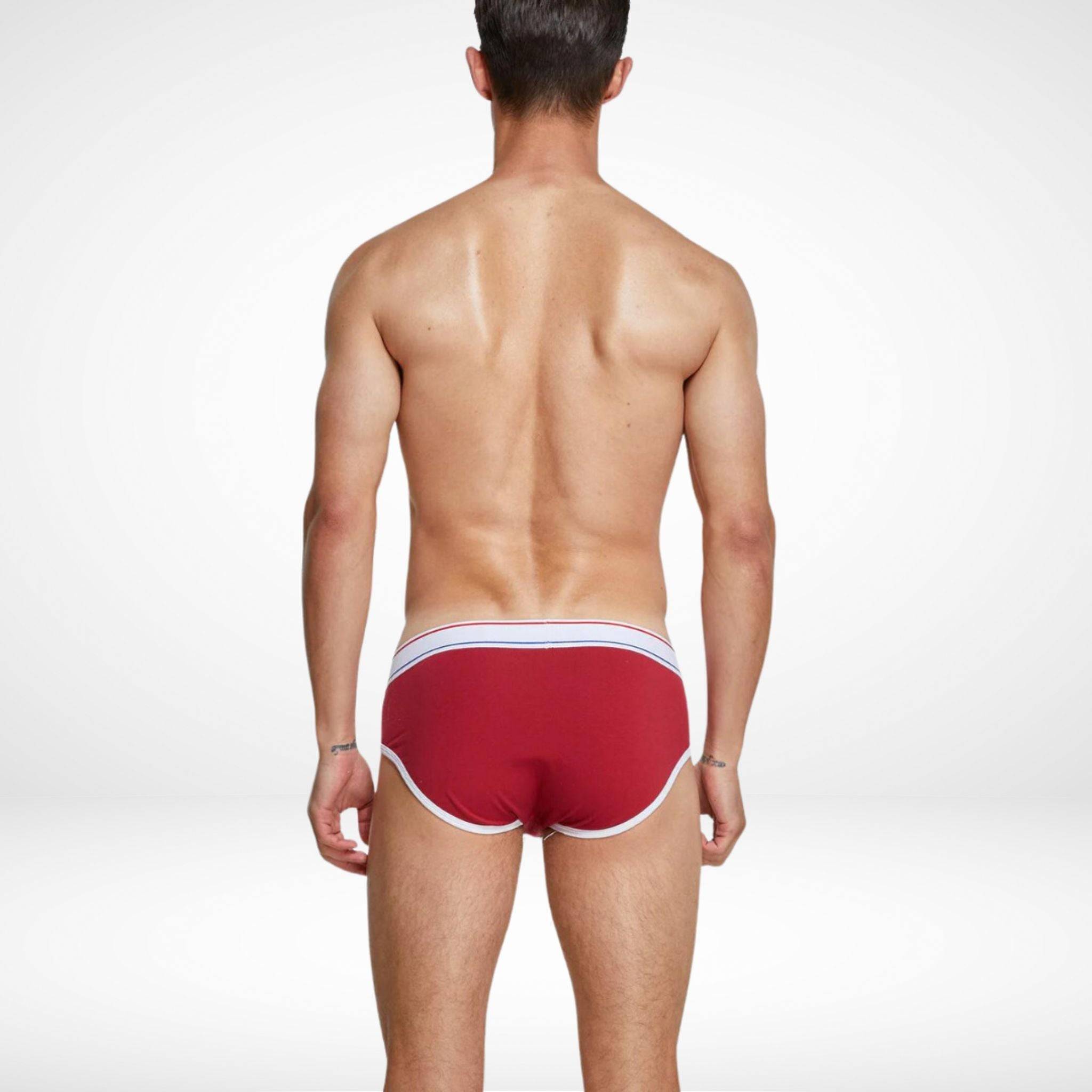 Back view of red breathable cotton stretch briefs for men featuring white piping and a comfortable, supportive design.