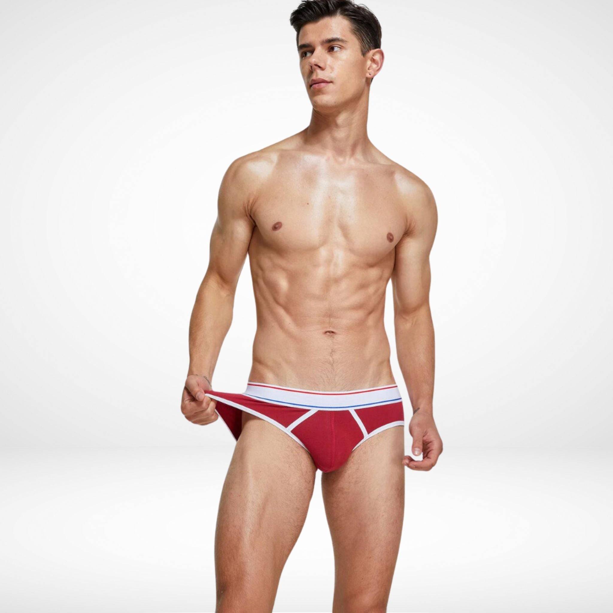 Red breathable cotton stretch briefs for men with white contrast piping, offering a snug and flexible fit.