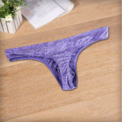 Flat-lay of purple breathable soft thong underwear for men, showcasing its soft fabric and ergonomic design for comfort.