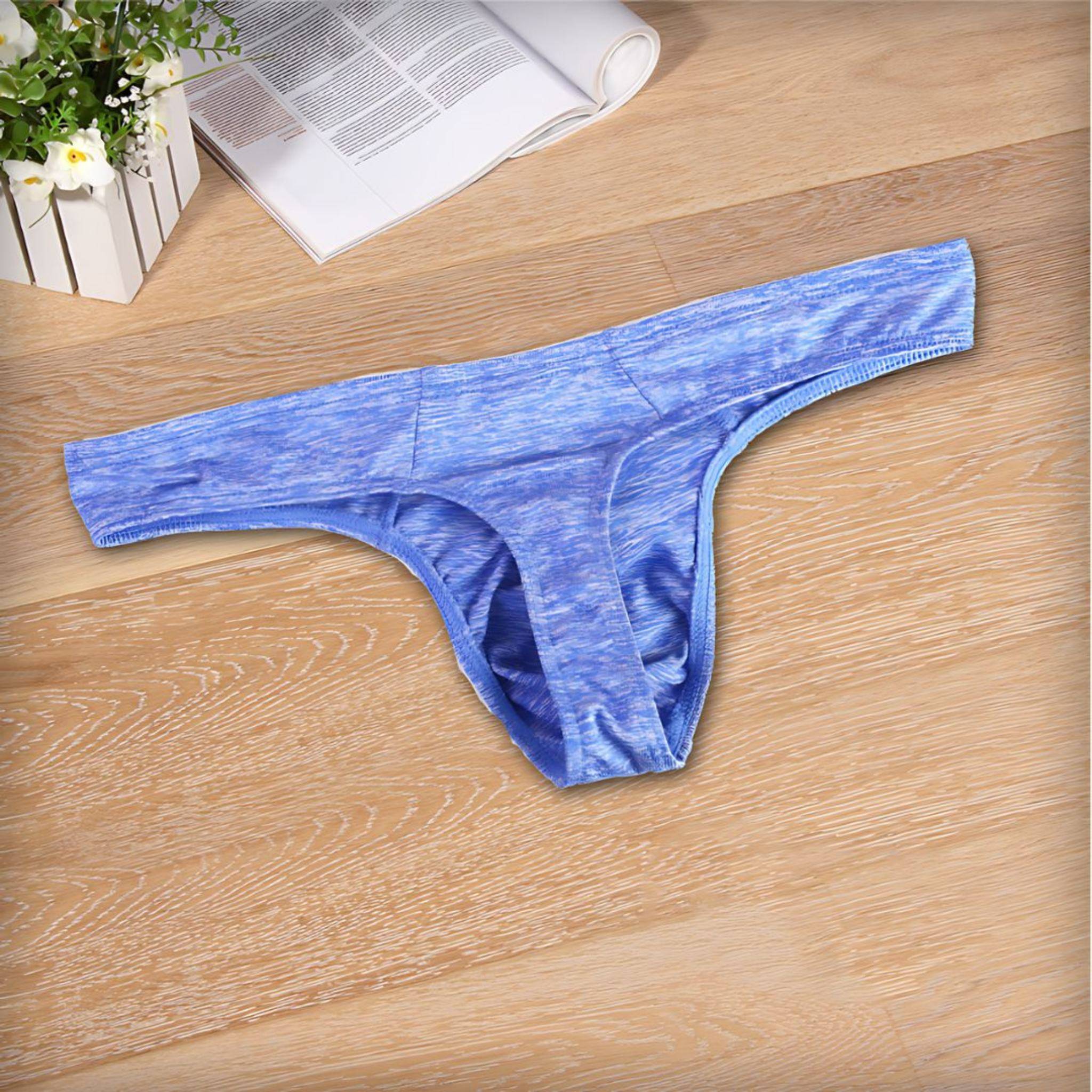 Flat-lay of blue breathable soft thong underwear for men, showcasing its soft fabric and ergonomic design for all-day comfort.