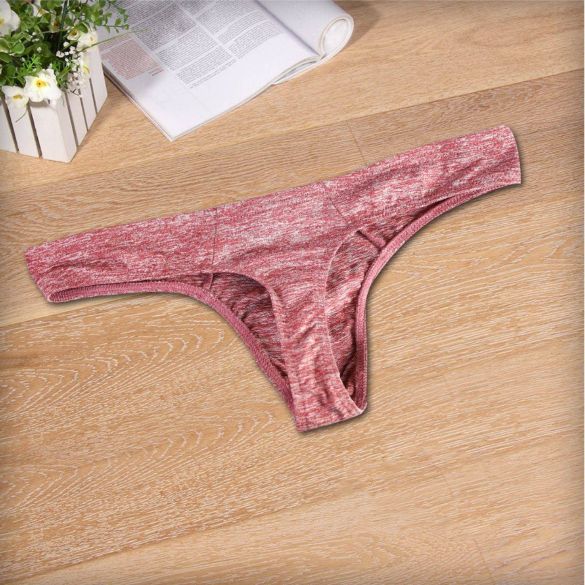 Flat-lay of red breathable soft thong underwear for men, showcasing its soft fabric and ergonomic design for comfort.