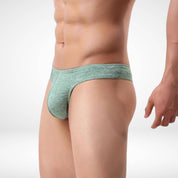 Side view of green breathable soft thong underwear for men, emphasizing the snug fit and breathable fabric.