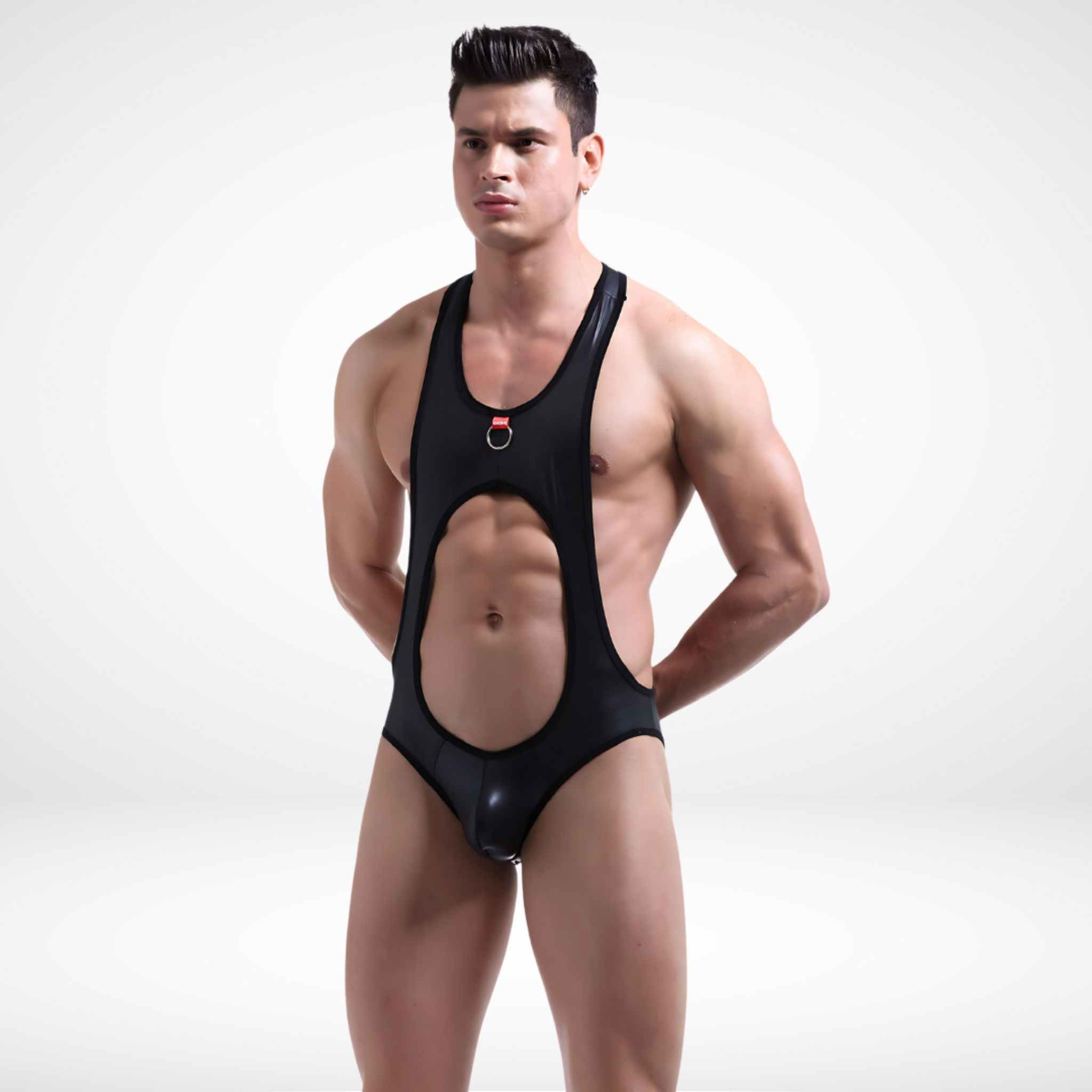 Men's faux leather open back jockstrap wrestling singlet with a bold cutout front design, featuring a metal ring accent and stretchable fit.