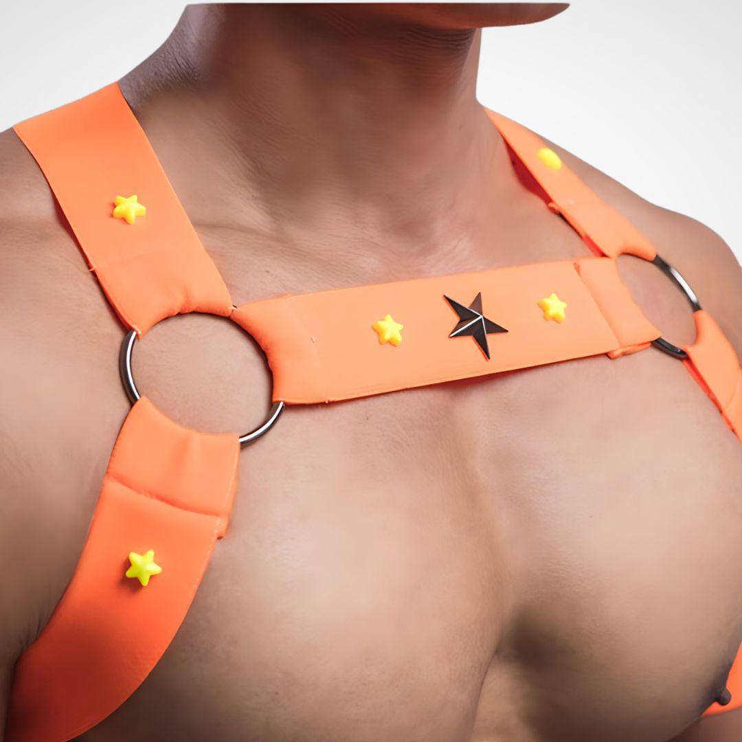 Close-up of orange neon circuit party harness with star accents and metal rings, showcasing its stylish and vibrant design.