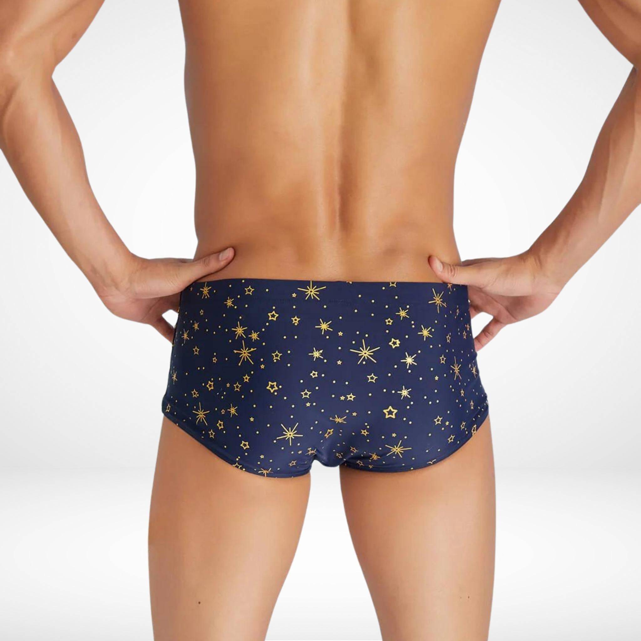 Back view of men's gold star swim trunks with a quick-dry fabric and bold star pattern, offering a snug and stylish fit for swimwear.