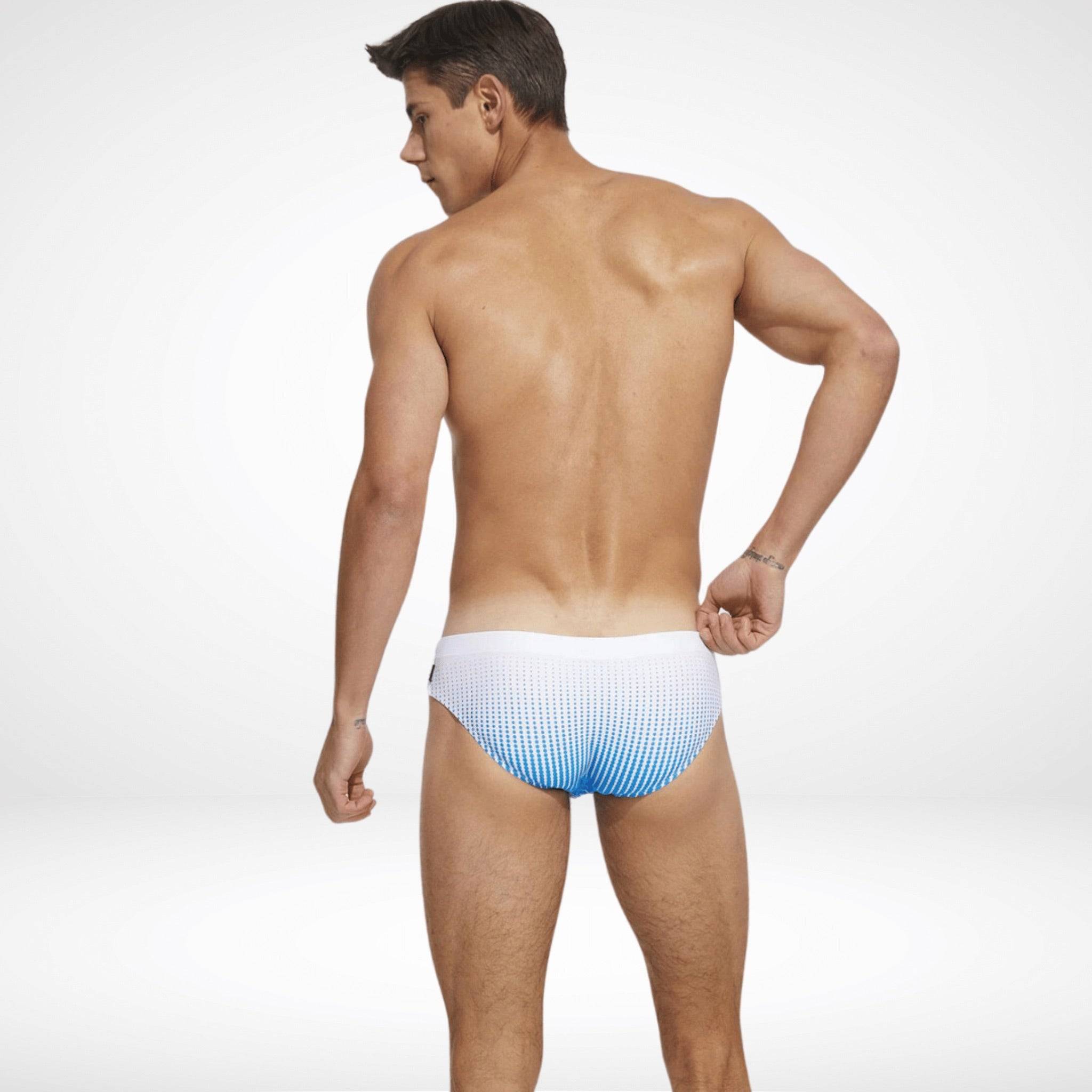 Back view of men's gradient swim briefs in white and blue, featuring a quick-dry fabric and athletic fit for beach or pool wear.