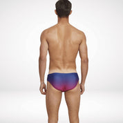 Back view of men's gradient swim briefs in navy and pink, showcasing a snug fit and vibrant gradient design for stylish swimwear.