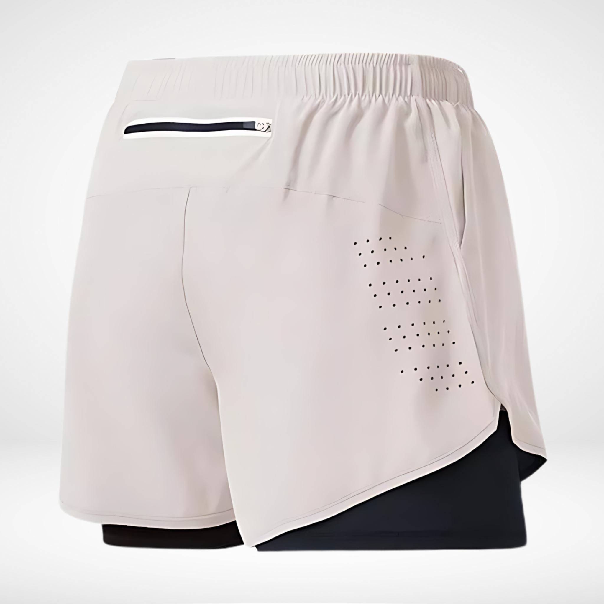 White METCON compression lined workout shorts with a built-in liner, zippered back pocket, and laser-cut ventilation for activewear.