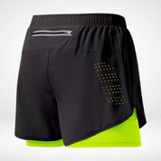 Black METCON workout shorts with neon green liner, zippered back pocket, and laser-cut ventilation, designed for running and gym use.