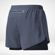 Gray METCON compression lined workout shorts with a built-in liner, zippered back pocket, and laser-cut ventilation for training.