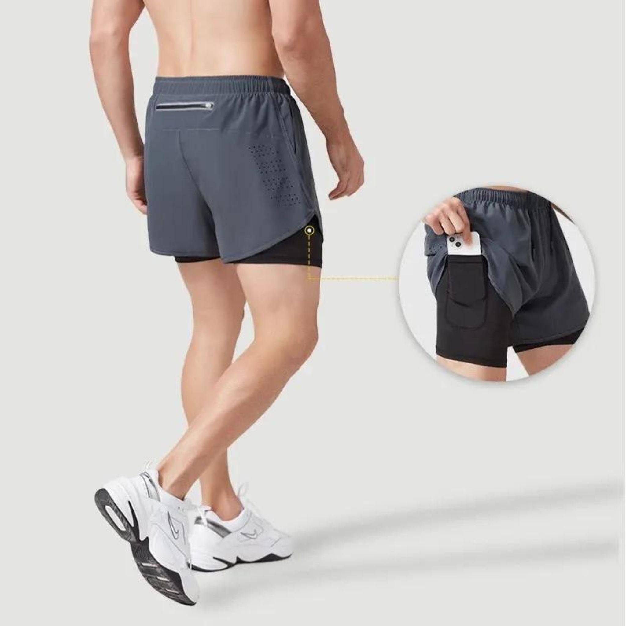 Men's METCON compression lined workout shorts in gray with a built-in liner, back pocket, and phone pocket detail, ideal for gym and running.