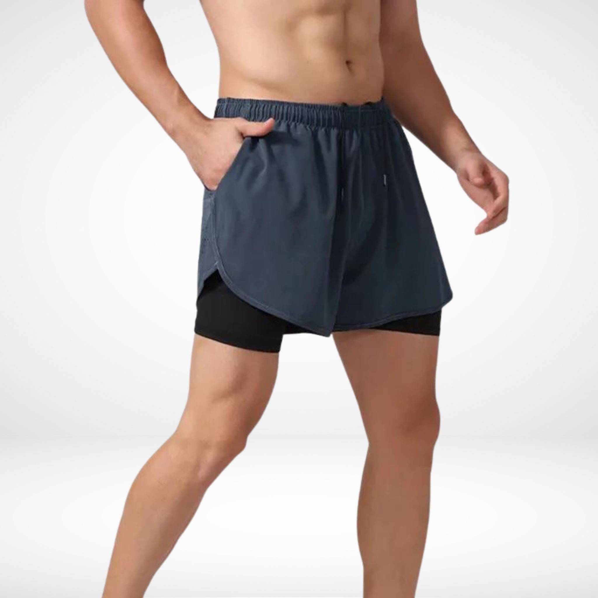 Front view of METCON compression lined workout shorts in gray, featuring a built-in liner and side pockets for training and running.