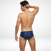 Back view of navy blue men's swim briefs with palm tree pattern, showcasing a snug and comfortable fit for swimming or lounging.