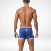 Back view of blue men's mesh pool and beach shorts with lightweight, airy material and comfortable fit for beachwear.