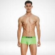 Front view of SeoBean soft breathable cotton men's boxer briefs in bright green, offering vibrant color and a comfortable fit.