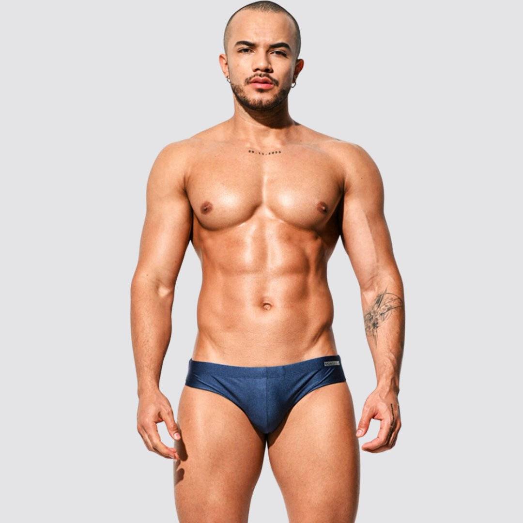 Men's shimmer low rise swim briefs in navy blue, front view showcasing a modern speedo-style fit and shimmering fabric.