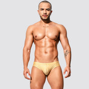 Men's shimmer low rise swim briefs in gold, front view showcasing sleek speedo-style fit and stretchy nylon-spandex material.