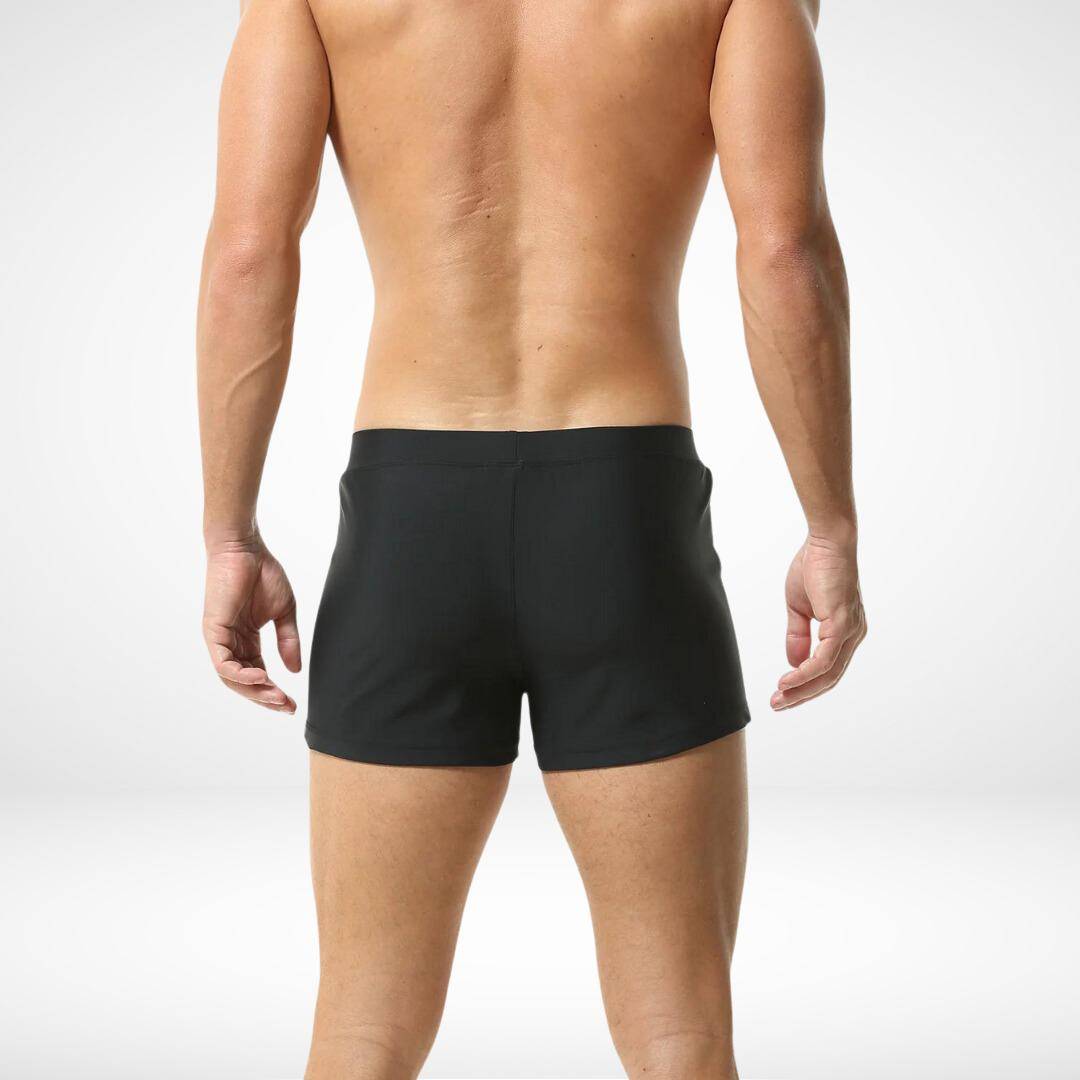 Back view of men's black square cut swim trunks showcasing a streamlined fit and smooth fabric for a stylish swimwear option.