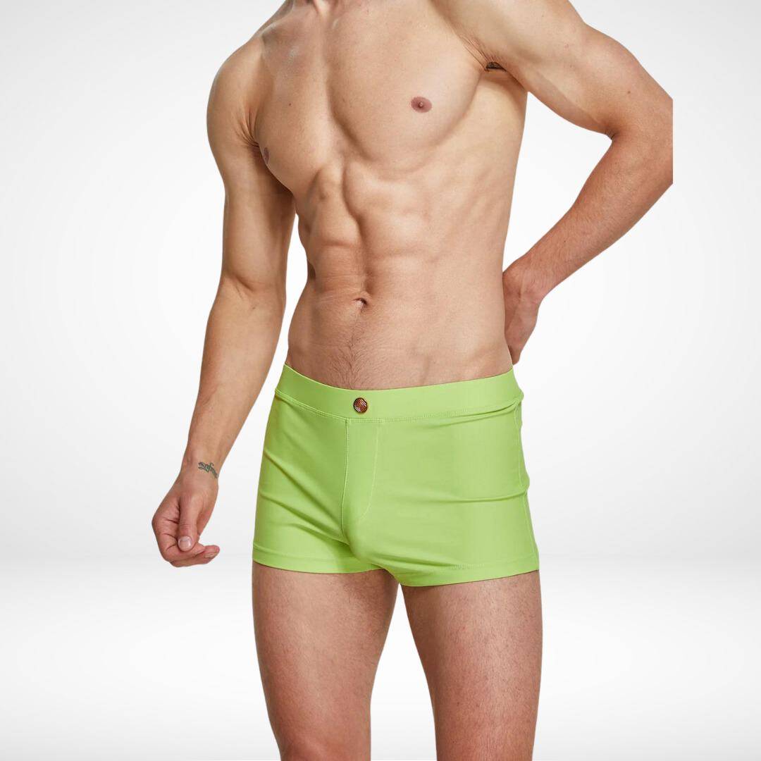 Men's lime green square cut swim trunks with a snug fit, crafted from quick-dry fabric for a bold and stylish swimwear option.