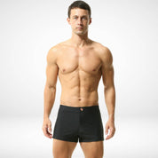 Men's black square cut swim trunks with a form-fitting design, featuring a quick-dry nylon-spandex blend and a sleek, minimalist style.