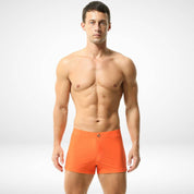 Men's orange square cut swim trunks with a snug fit, crafted from quick-dry fabric for a bold and stylish swimwear option.