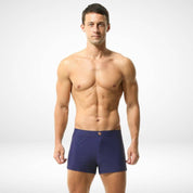 Men's navy blue square cut swim trunks with a snug fit, made from a quick-dry nylon-spandex blend for a stylish and functional swimwear choice.