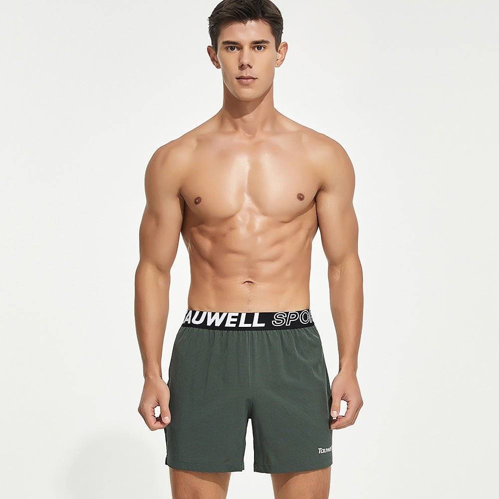 Front view of green men's lined gym training shorts with a Tauwell branded waistband, offering moisture-wicking and quick-dry comfort.