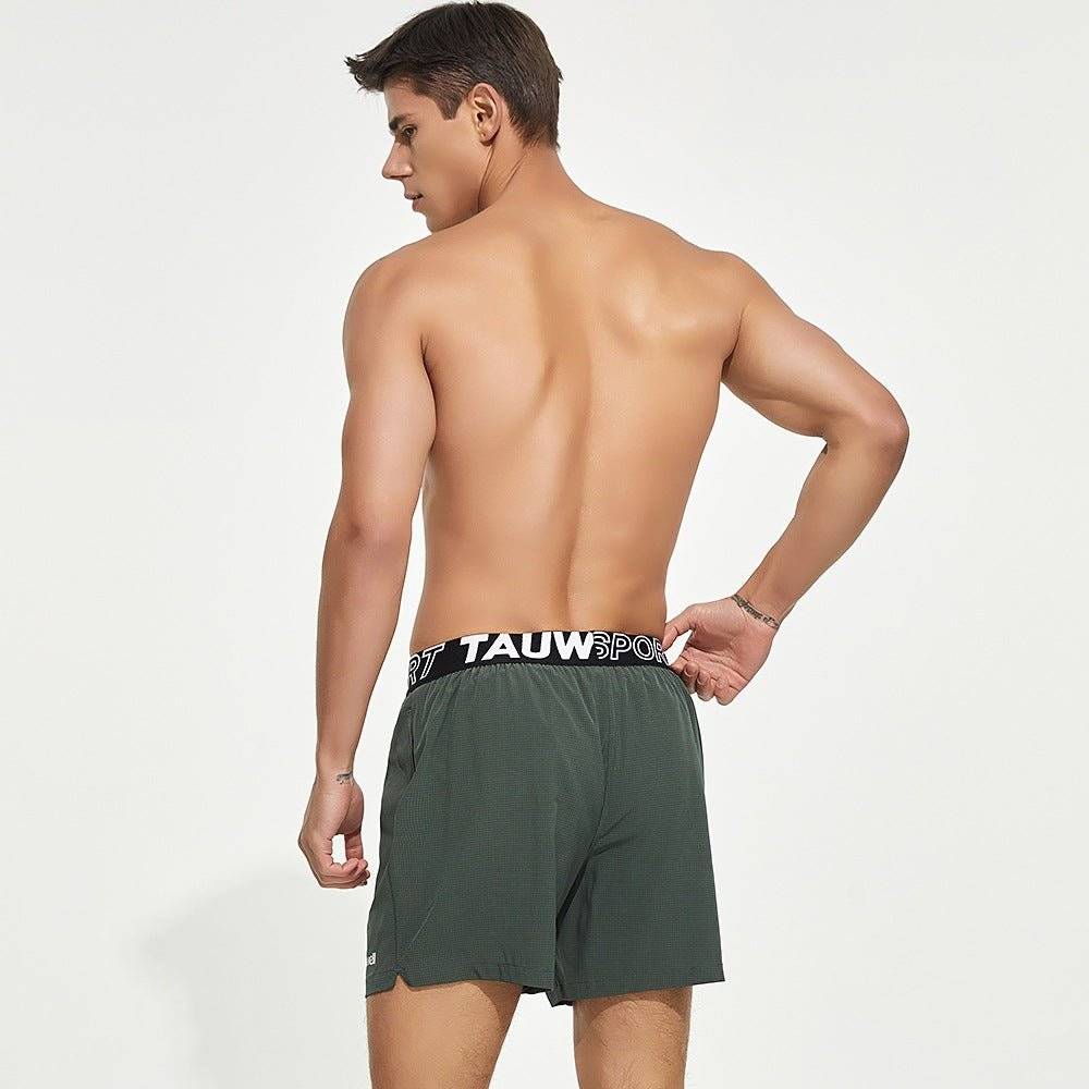 Back view of green men's lined gym training shorts with a Tauwell branded waistband, highlighting a breathable and flexible design.