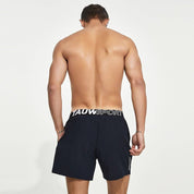 Back view of navy blue men's lined gym training shorts with a Tauwell branded waistband, showcasing a comfortable and supportive fit.