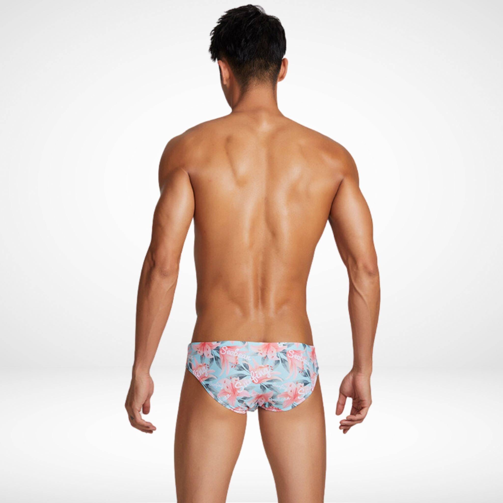 Back view of Men's Water Lily Swim Briefs in a light floral pattern, highlighting a comfortable and flattering fit for swimming or lounging.