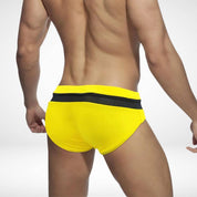 Rear view of yellow and black zipper front swim briefs, highlighting the bold color contrast and comfortable fit.