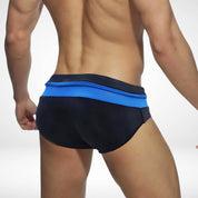 Rear view of black and blue zipper front swim briefs, showcasing a sleek and comfortable design for swimwear.