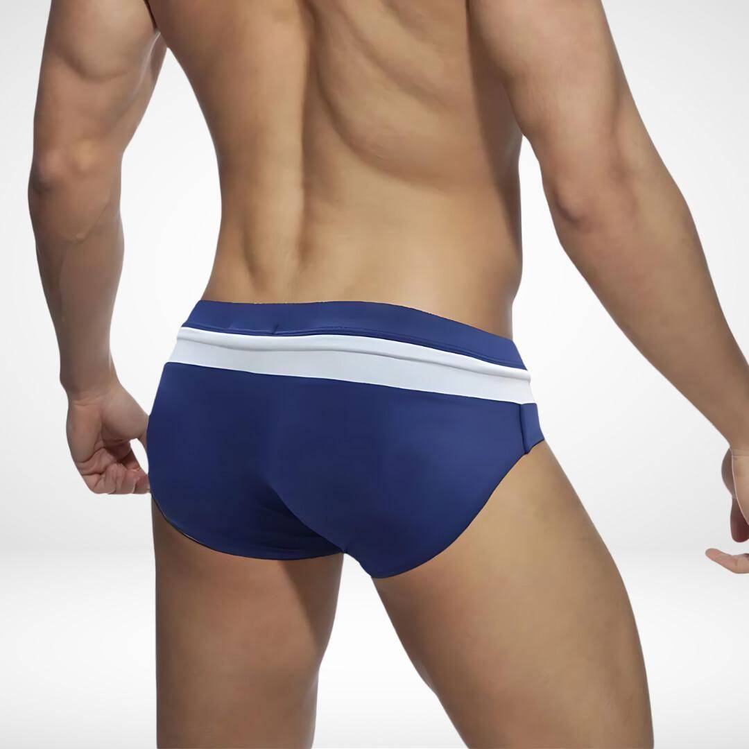 Rear view of navy blue and white zipper front swim briefs, showcasing a clean and comfortable swimwear design.