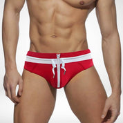 Red and white zipper front swim briefs with a drawstring tie, designed for a bold and eye-catching summer outfit.