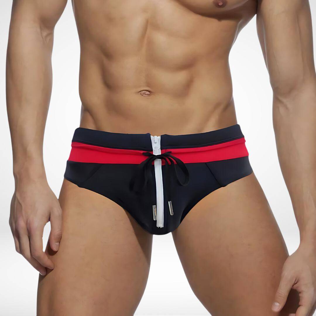 Black and red zipper front swim briefs with a drawstring tie, designed for a bold and fashionable summer look.