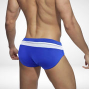 Rear view of blue and white zipper front swim briefs, showcasing a sleek and comfortable fit for swimming.