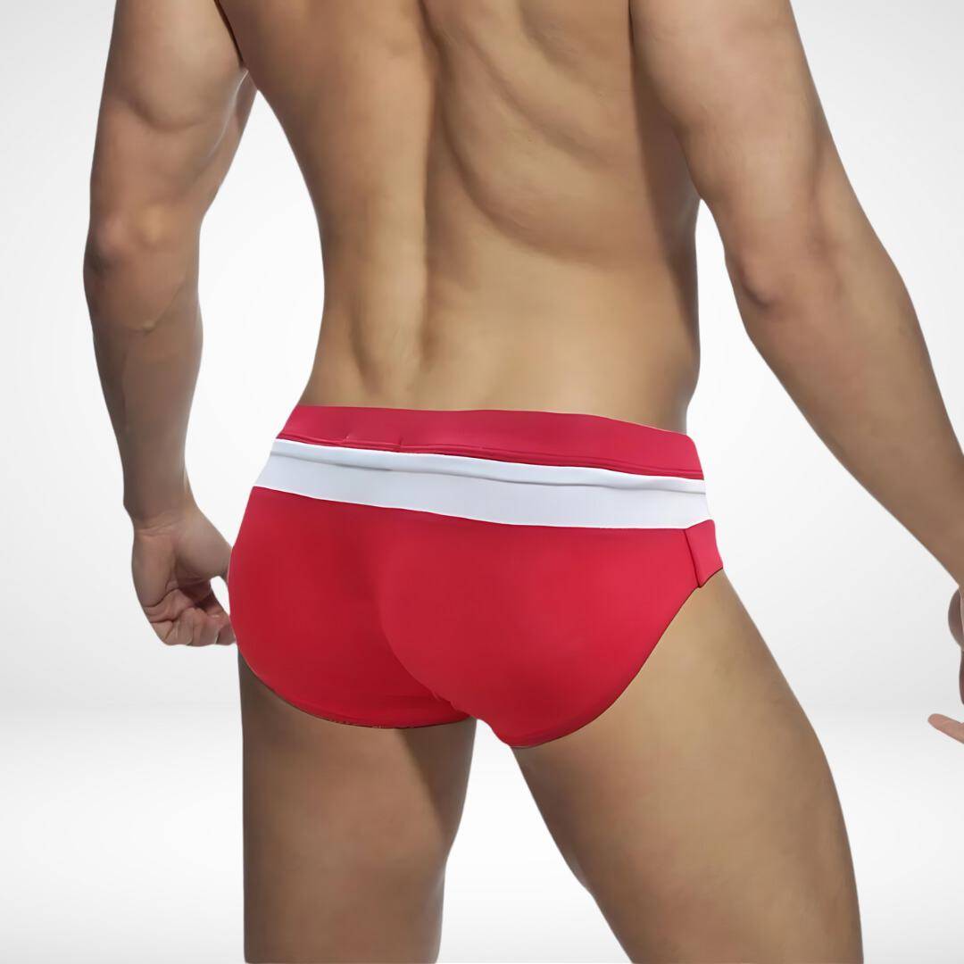 Rear view of red and white zipper front swim briefs, highlighting the vibrant color and snug fit for swimwear.